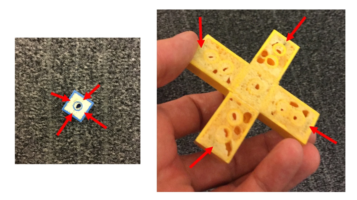 Magnets have been glued to the inside surfaces of the Legos (indicated here by red arrows) and the hollow undersides filled in with spray foam.  (Click to enlarge.)