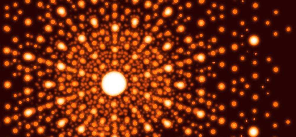 Fig. 3 (Click to enlarge). X-ray crystallography allows us to study the structure of various kinds of crystals by looking at the patterns light makes when we shine it through the crystal. This example shows one type of pattern that can be produced by shining an x-ray beam through a crystal onto a special screen.