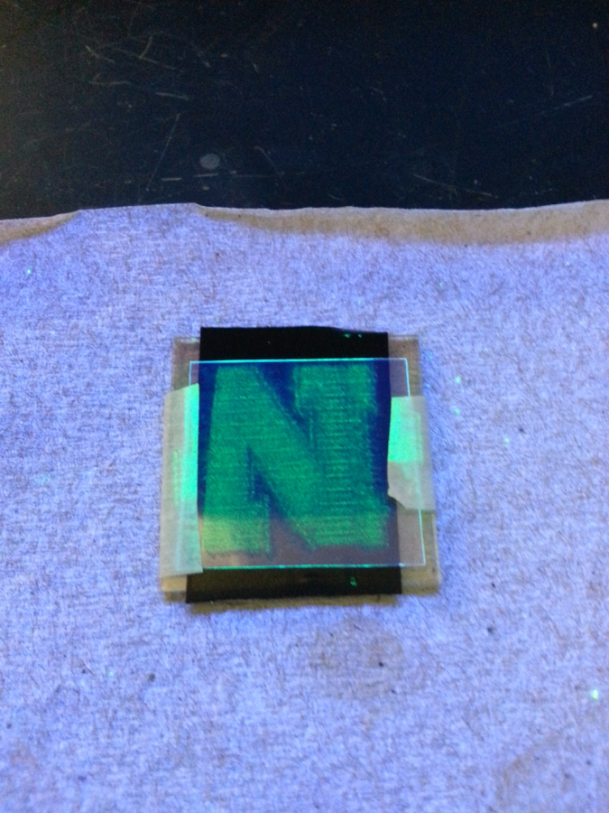 Fig. 3 (Click to enlarge). Optical photograph of the perovskite films under ultraviolet light shows that the films are photoluminescent. 